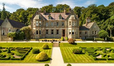 Magherarmorne Estate gardens with house to the rear