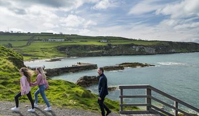 Family walking around Portmuck Harbour