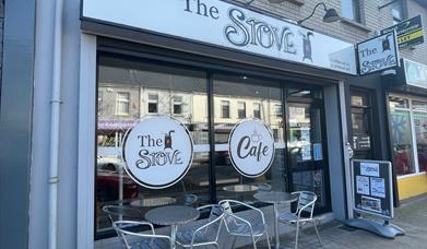 Exterior of The Stove in Larne with seats outside