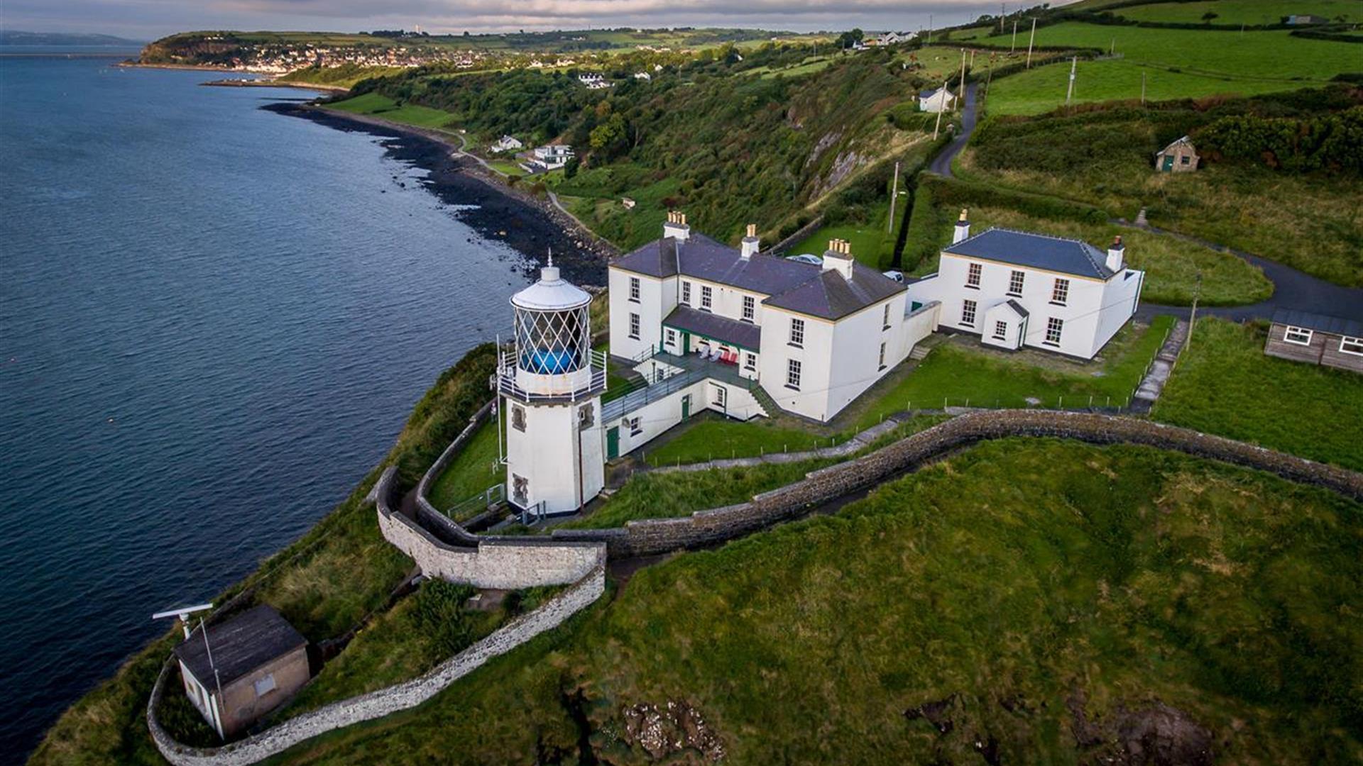 Aerial view of Blackhead Lighthouse and the Lightkeeper cottages