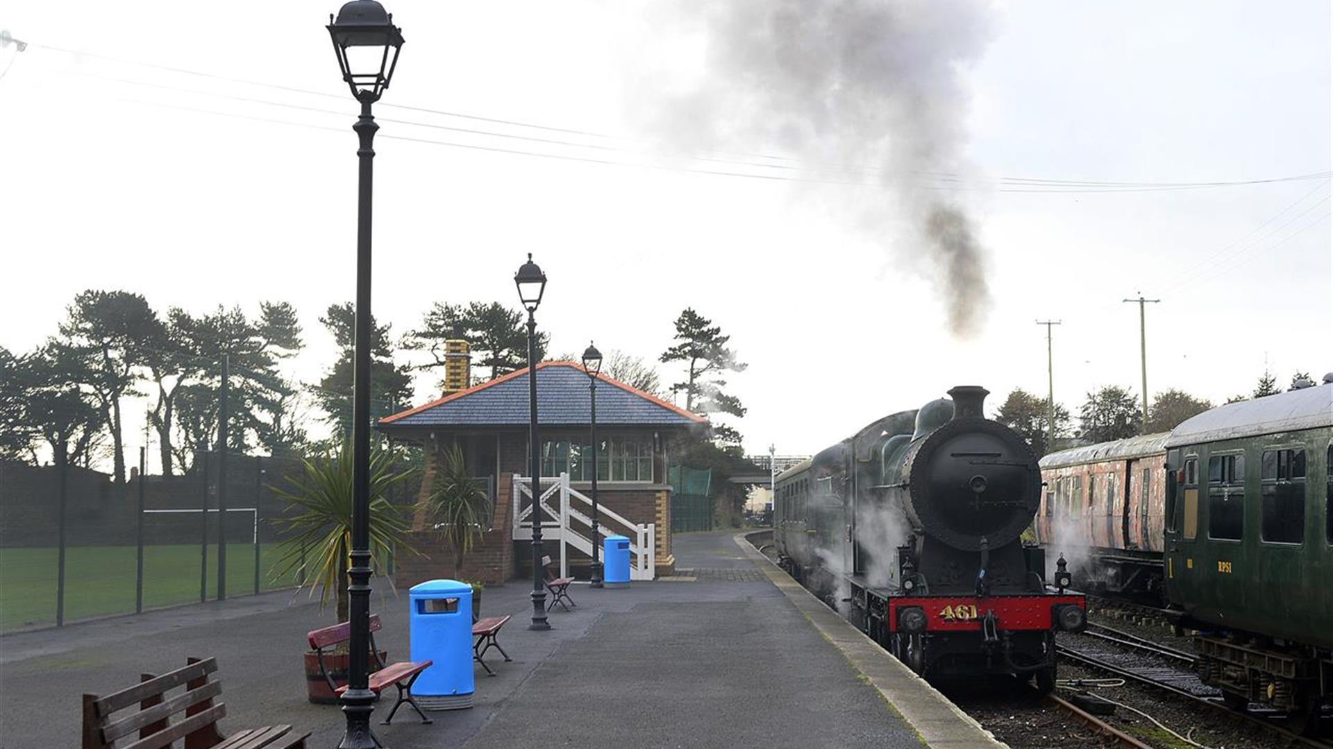 Steam train onn platform at Whitehead Railway Museum