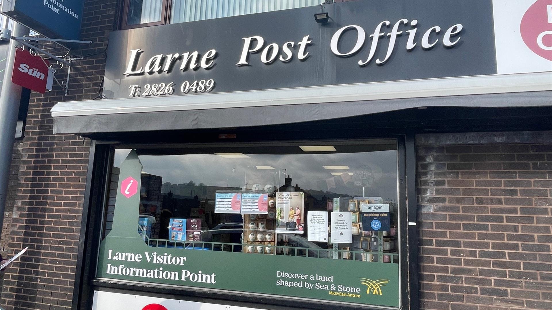 Exterior of the Book Nook in Larne with signage to promote Larne Post Office, Larne Visitor Information Point and MoneyGram