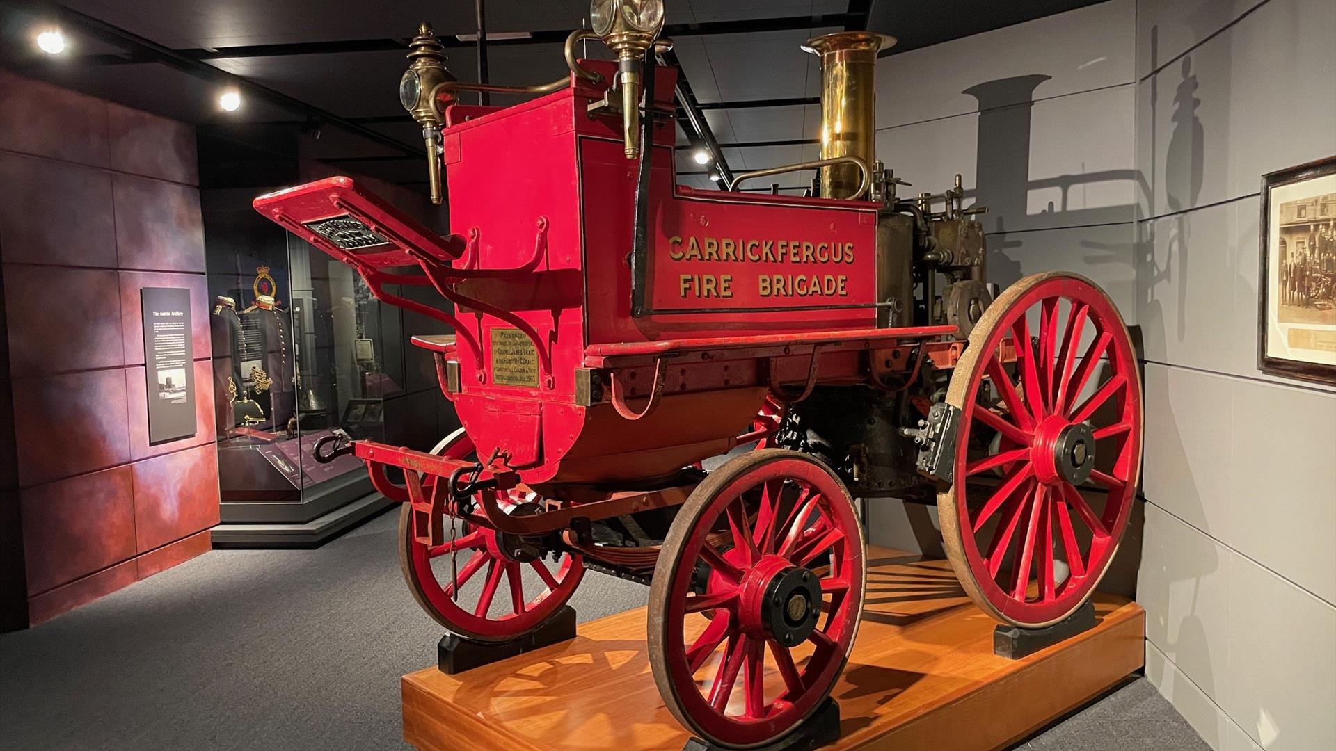 Red vintage pull along fire carriage branded Carrickfergus Fire Brigade