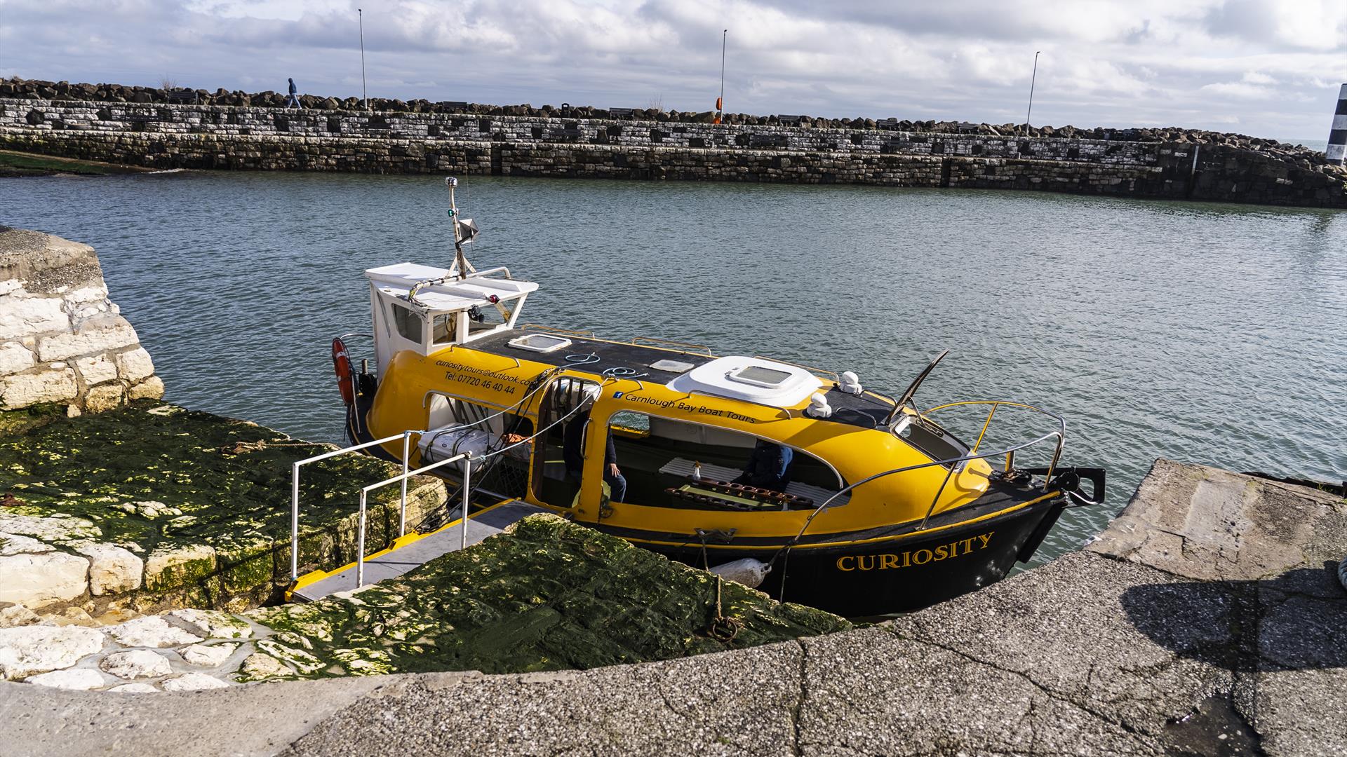 Curiosity boat sitting in Carlough harbour.