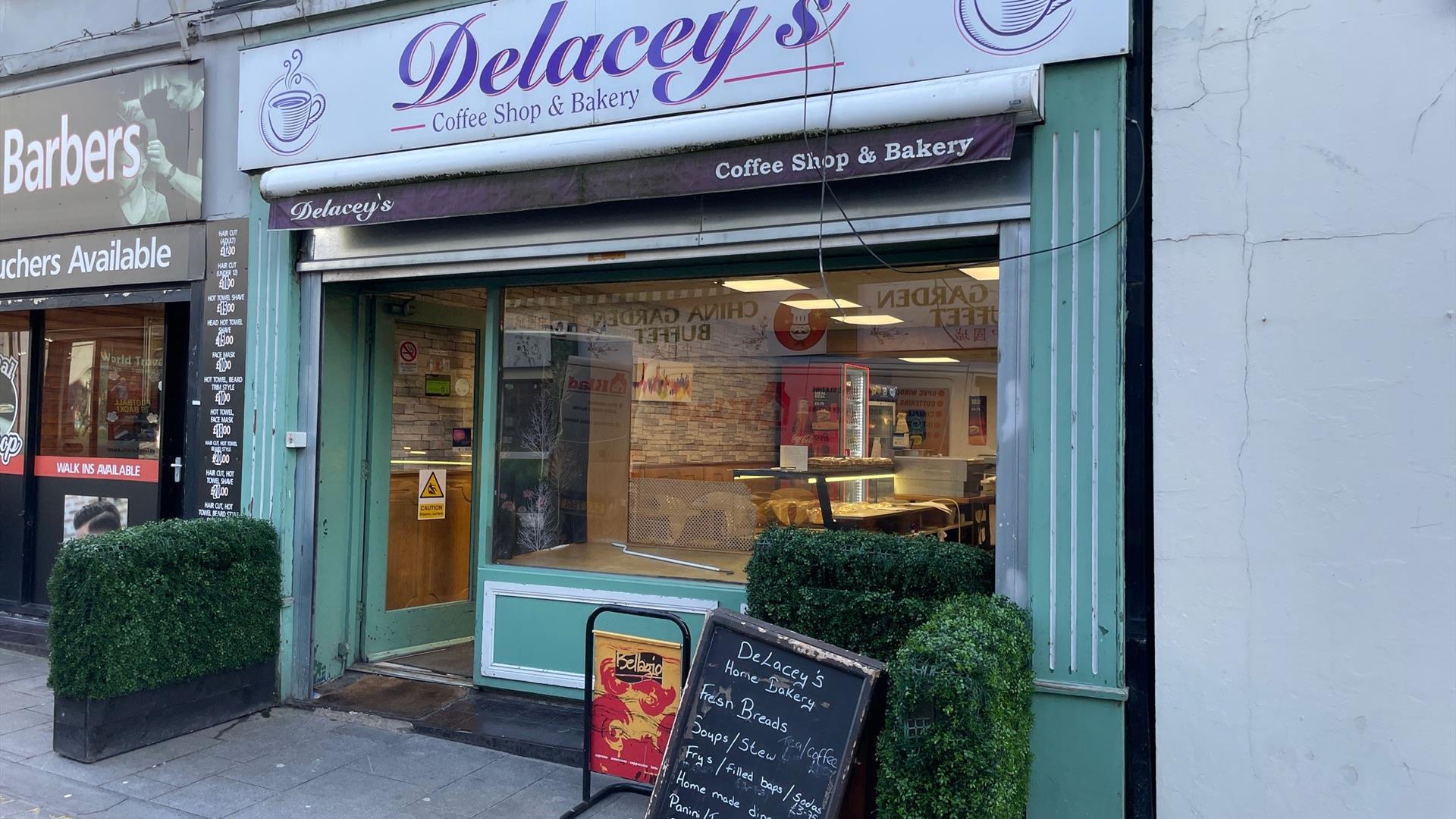 Light green and purple exterior of Delaceys Bakery Cafe in Carrickfergus