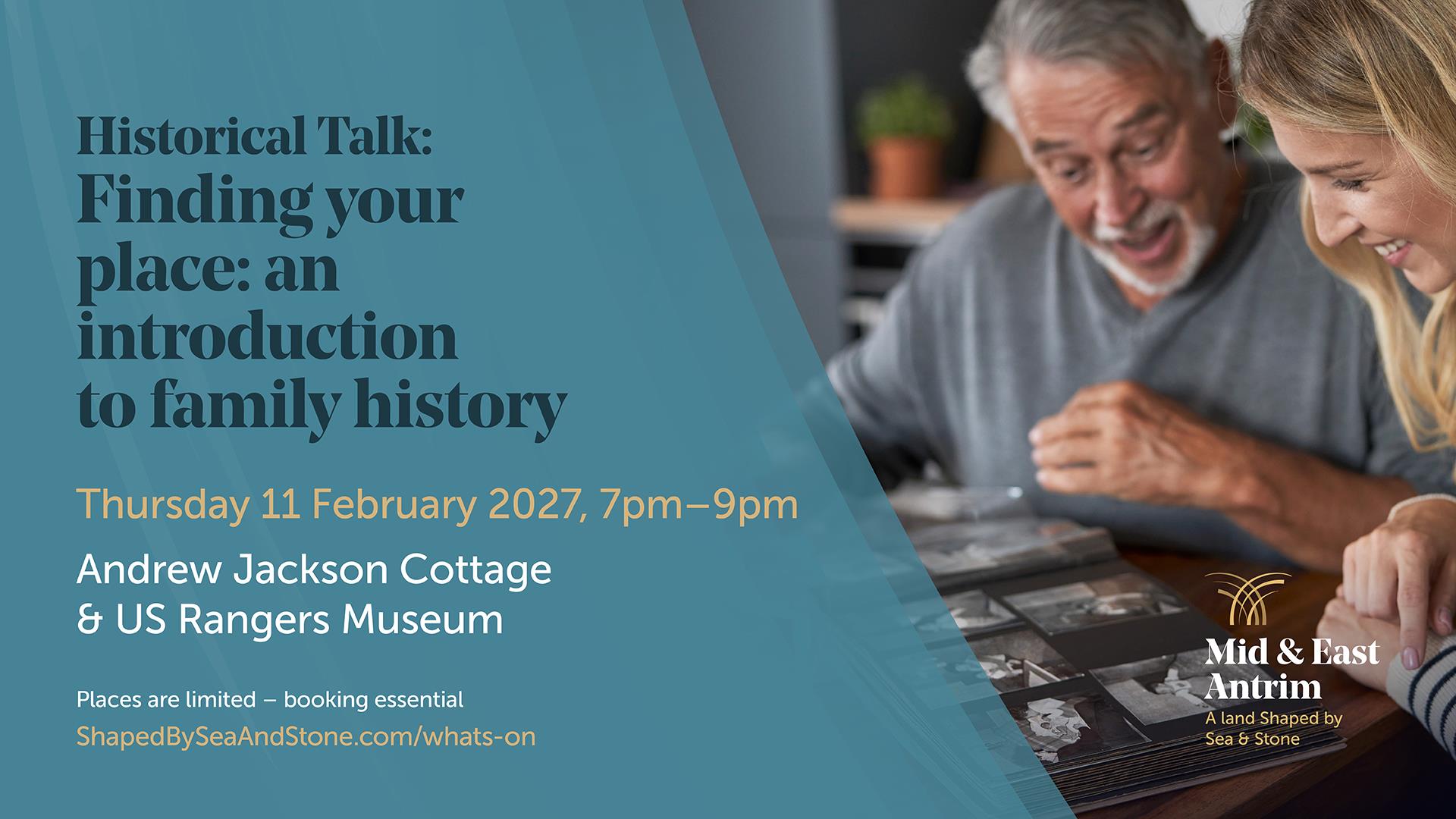 A man and a woman sitting at a table looking at photographs