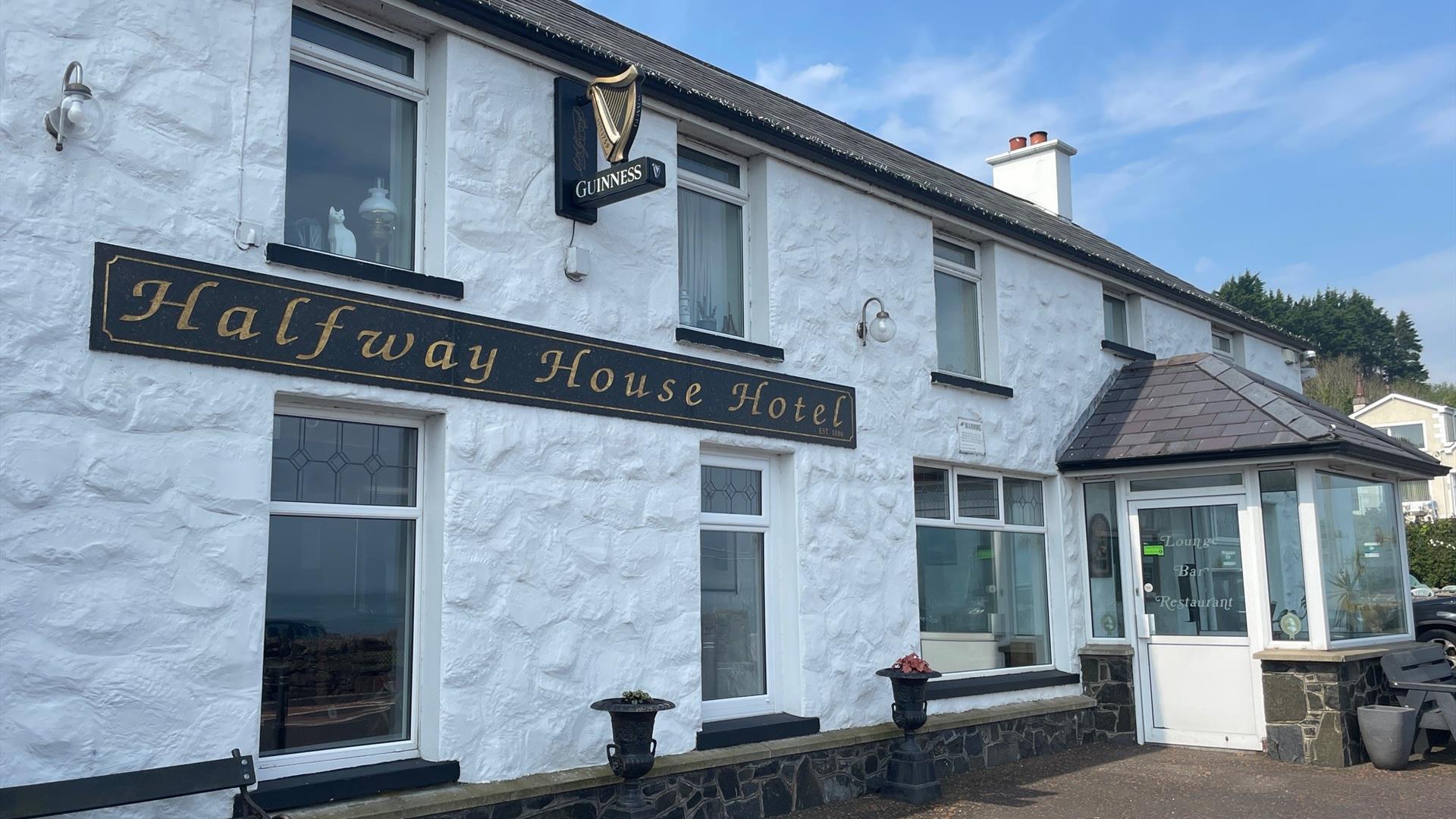 Whitewashed wall exterior of Halfway House Hotel in Ballygally