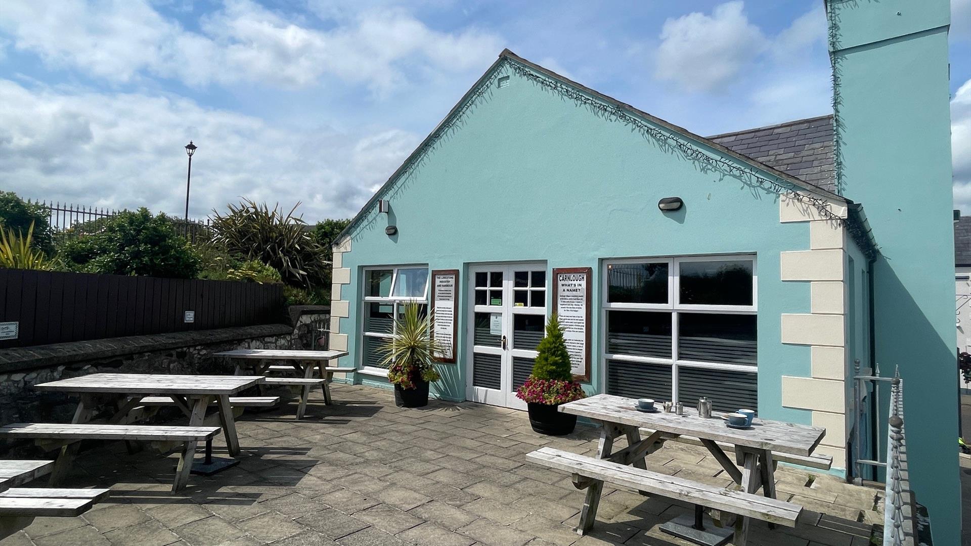 Exterior seating area of Harbour Lights Cafe in Carnlough