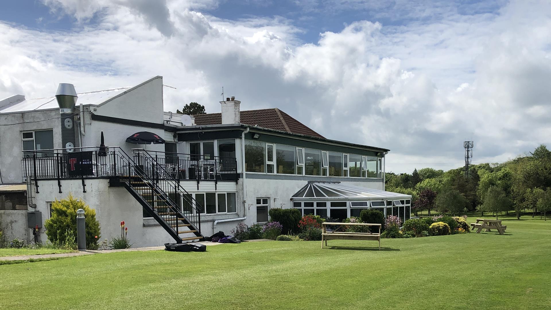 Cairndhu Golf Club ClubHouse - rear view with restaurant windows facing onto golf course.