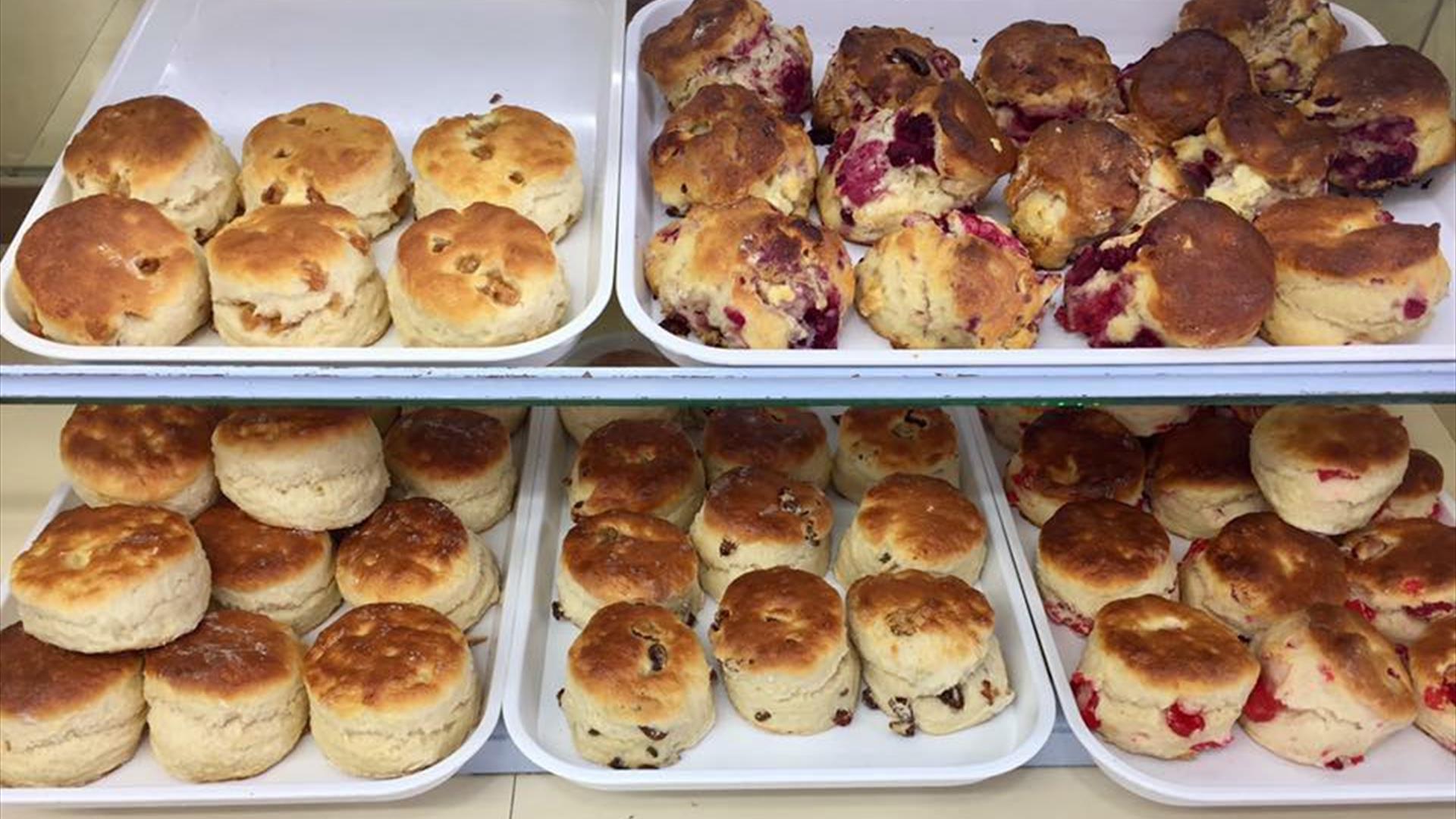 Trays of different flavoured scones