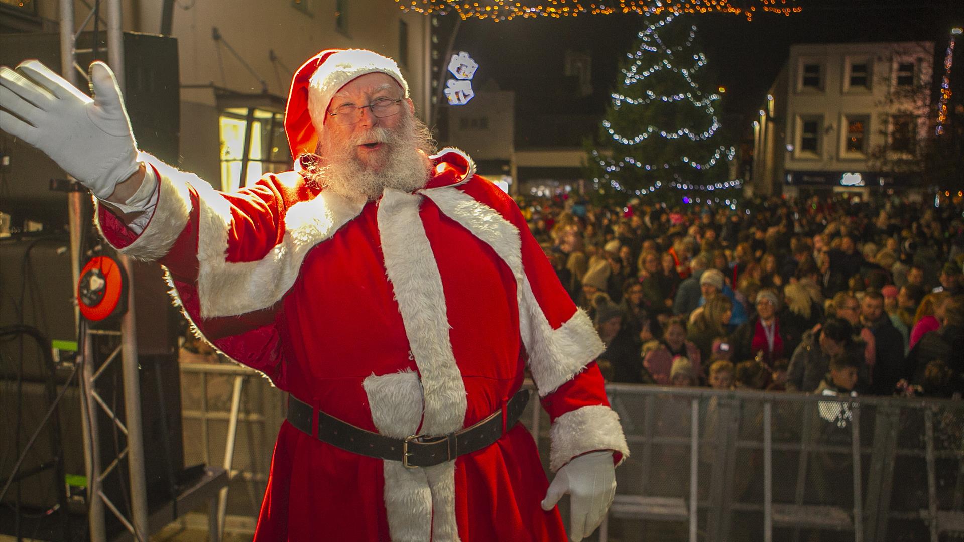 Santa turning on the Christmas Lights