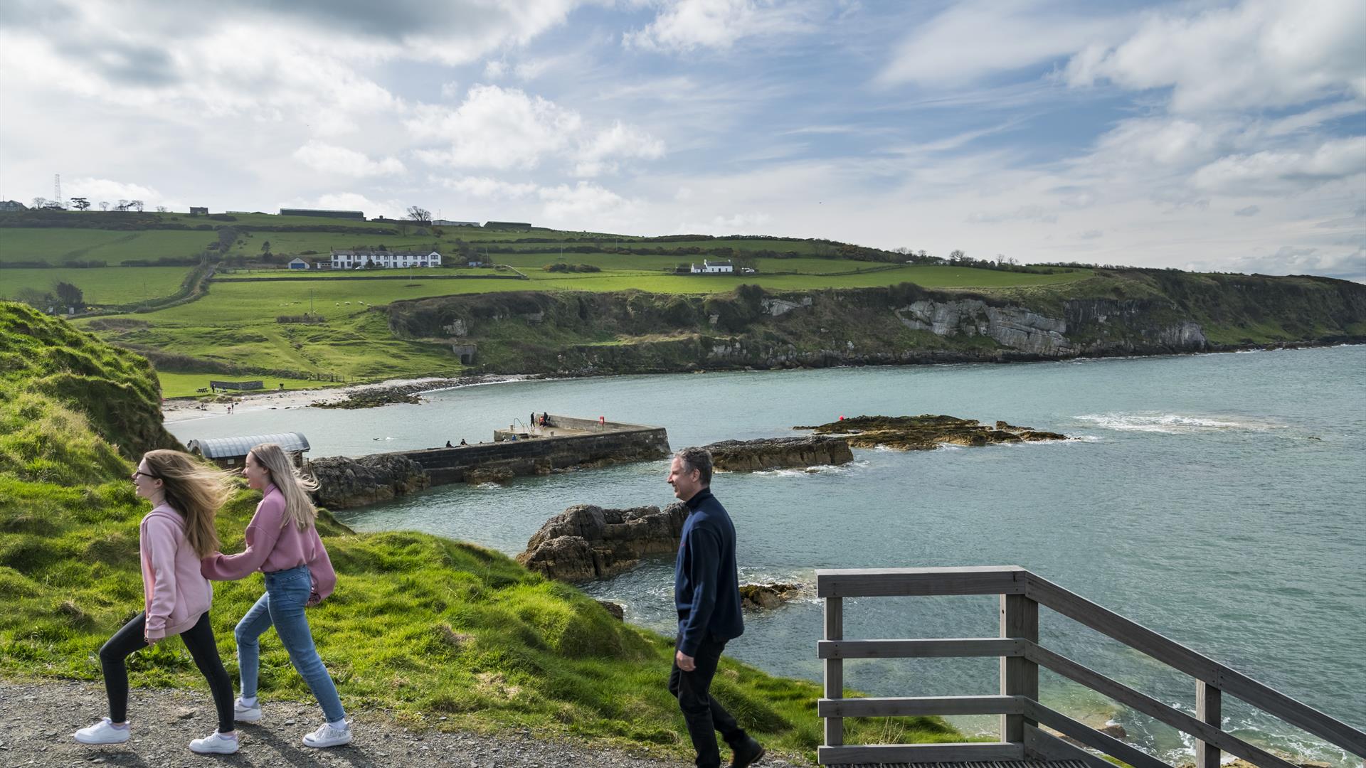 Family walking around Portmuck Harbour