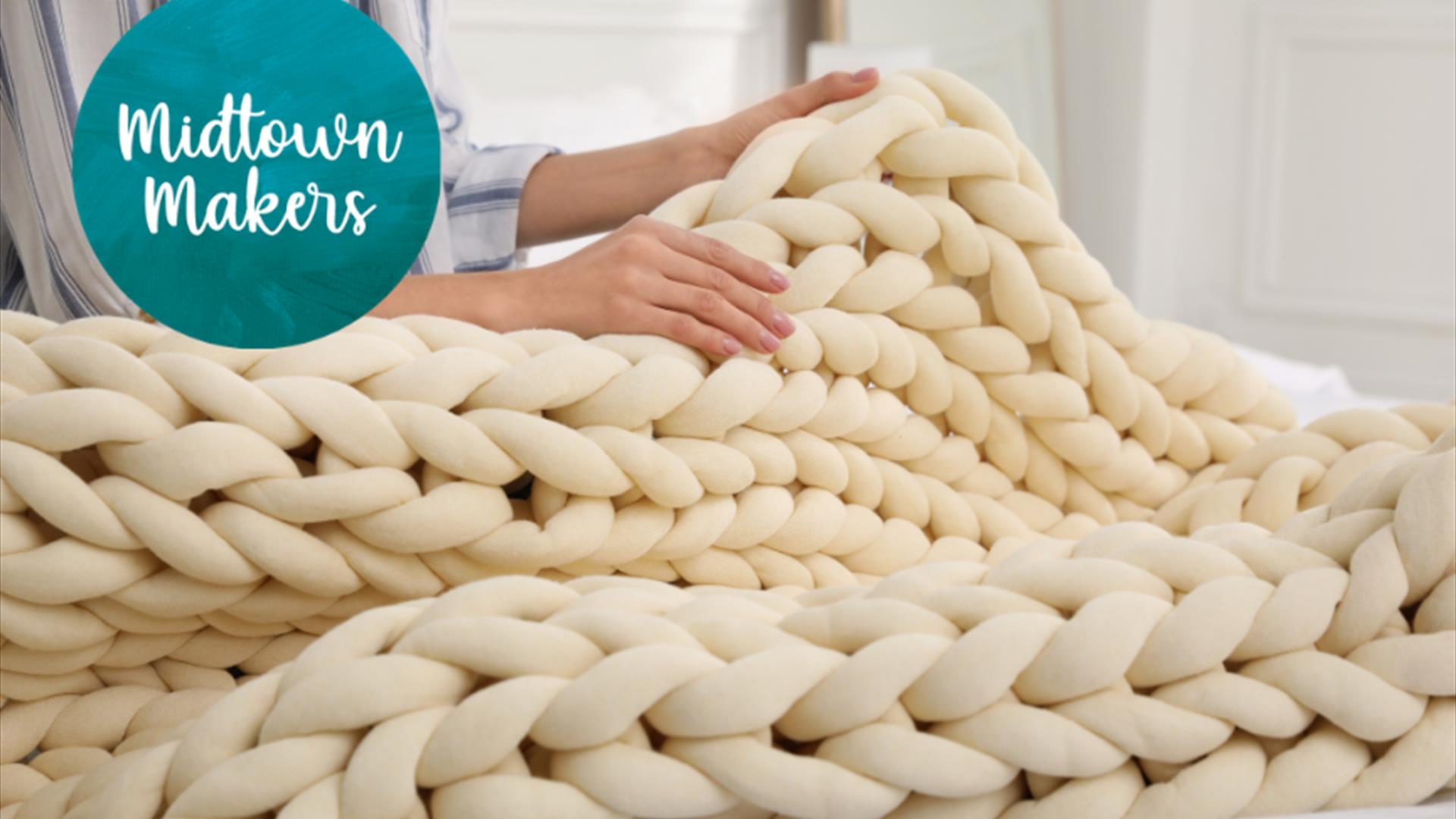 finger knitted chunky white blanket