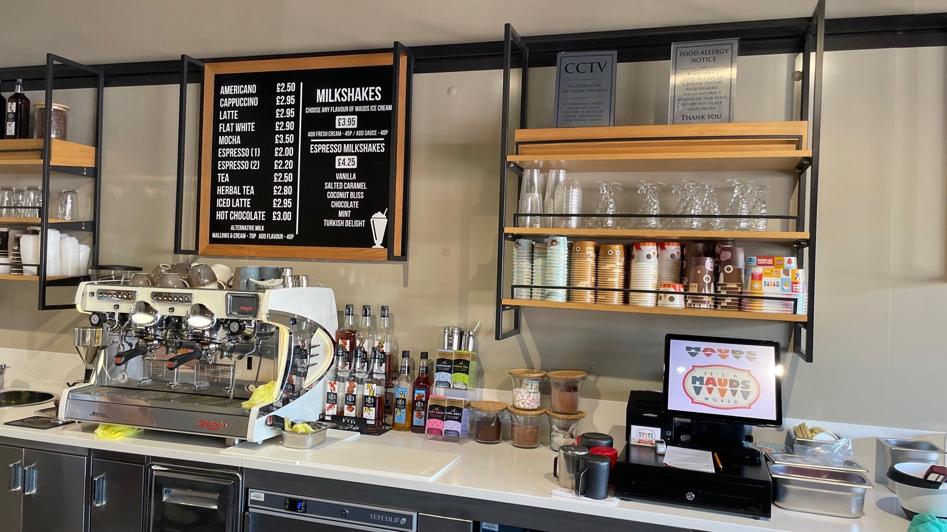 Serving counter at Mauds with hot drinks menus, coffee machines and ice cream containers