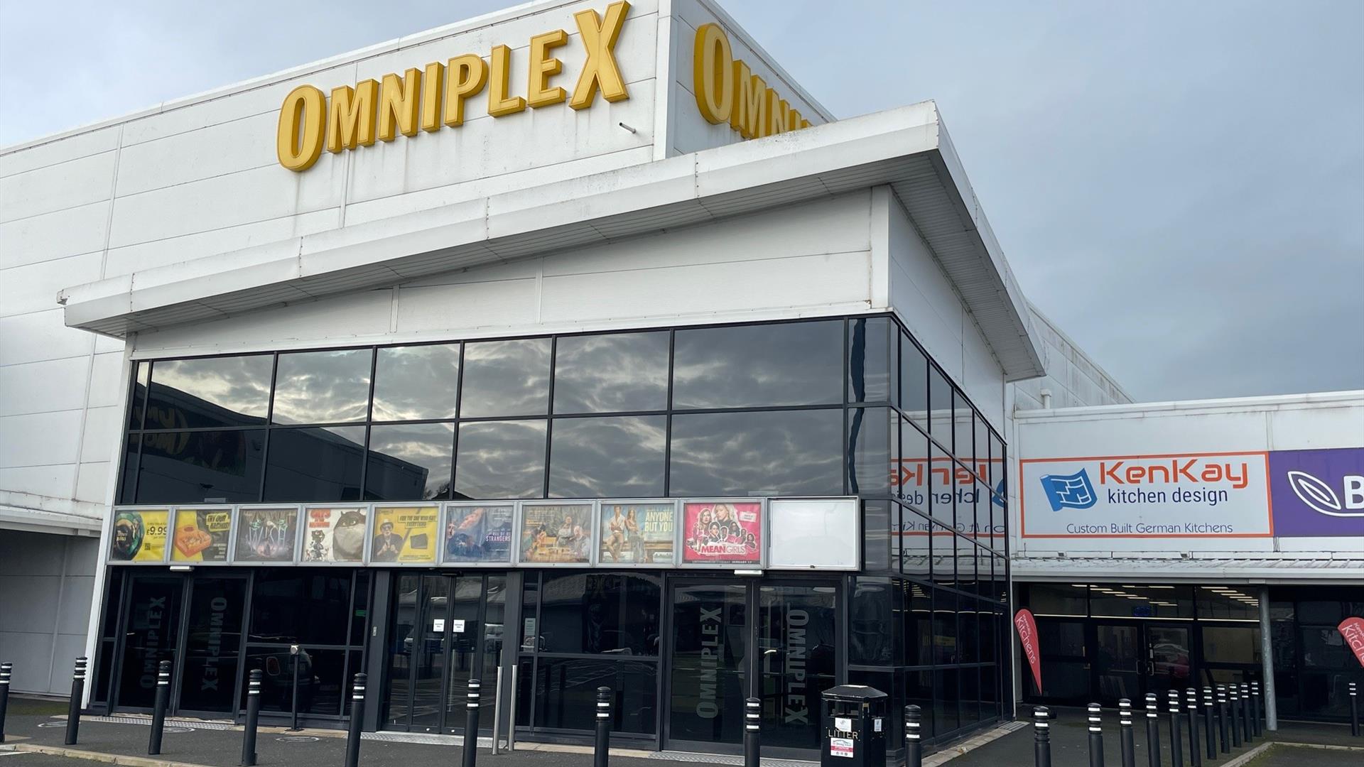 Omniplex Larne glass fronted exterior and entrance with poster signs displayed and large omniplex sign