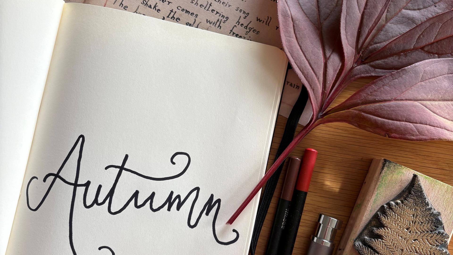 Picture  of autumn notebook and art materials