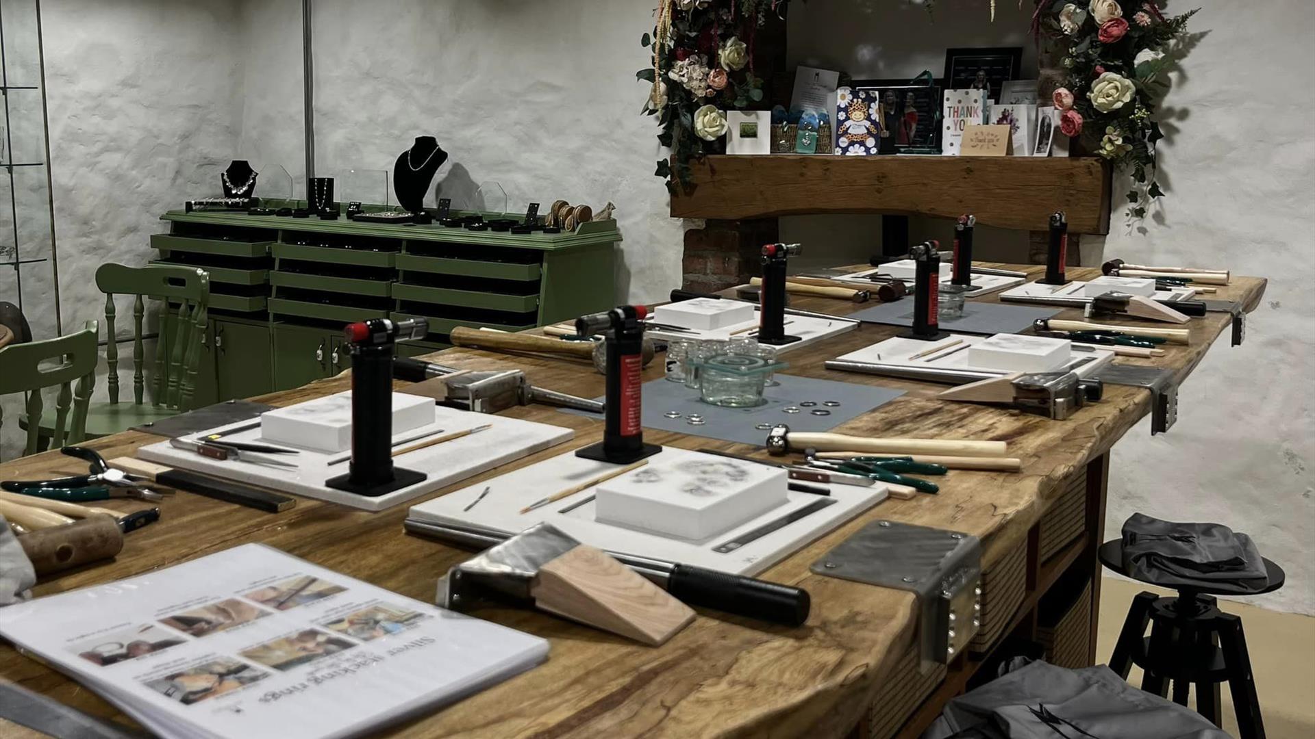 Table set up with equipment for jewellery making class at Vera McCullough's