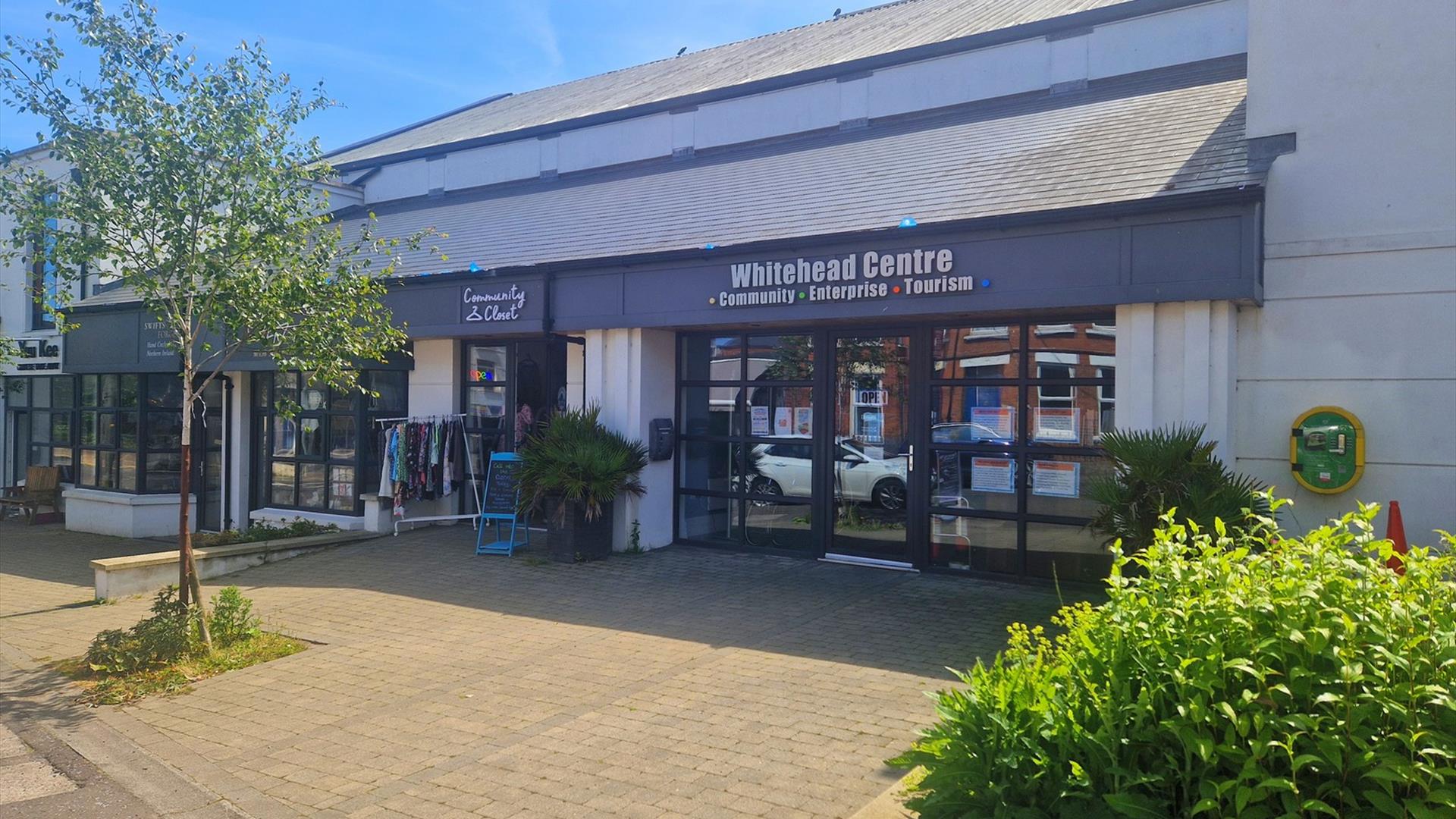 Photograph of Whitehead Centre with e-bikes display in a row.