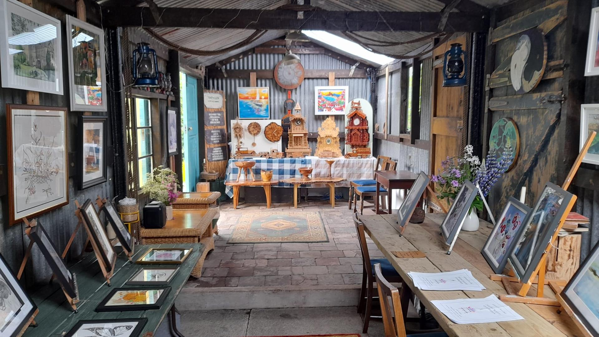 Artworks displayed as part of an exhibition in a barn
