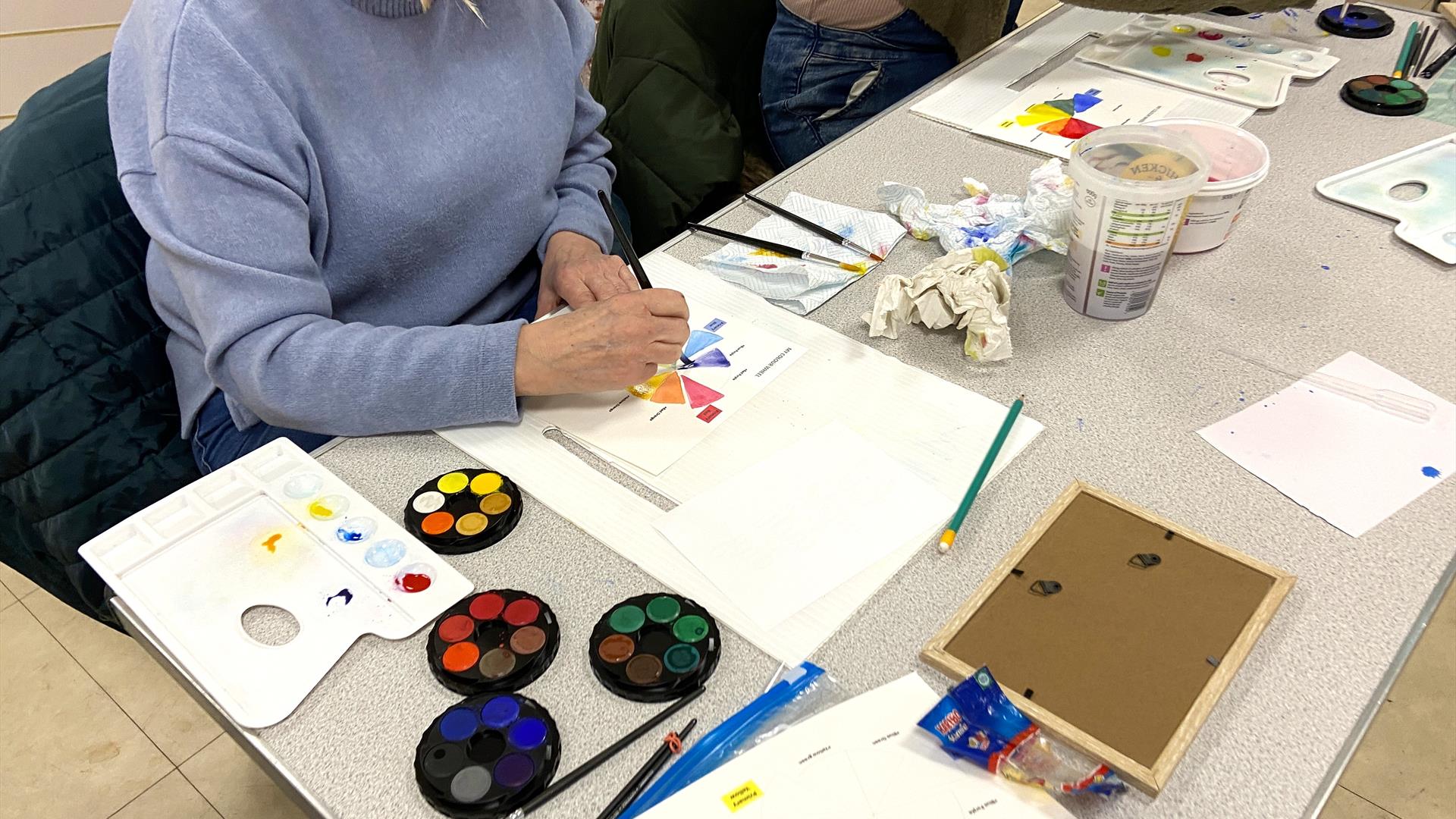 woman learning how to mix watercolours at Midtown Makers