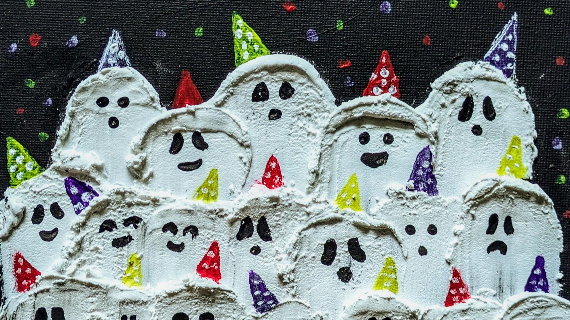 art canvas with 3 rows of ghosts painted on it.