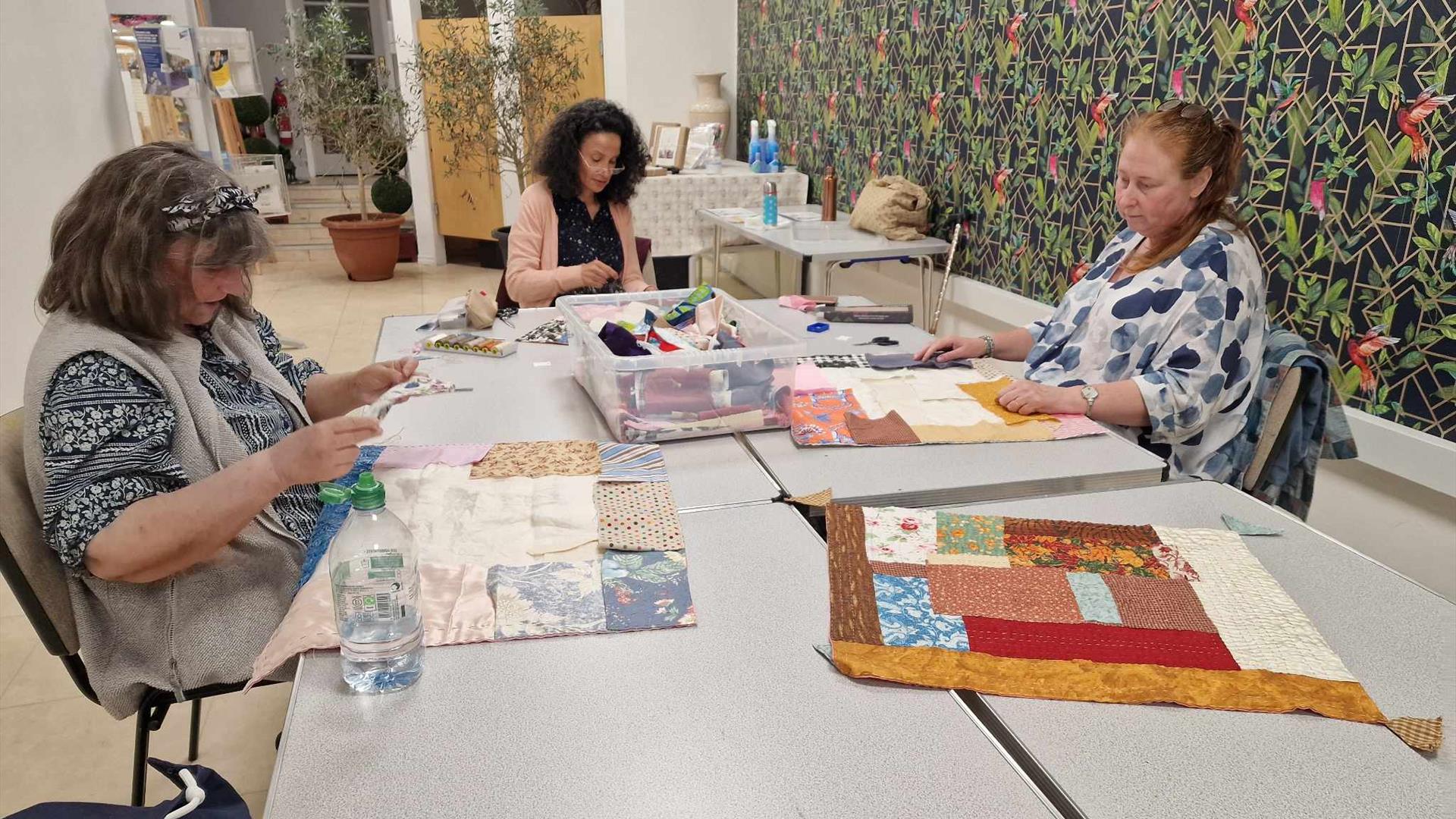 Sandra Streeter and 2 women learning quilting at Midtown Makers