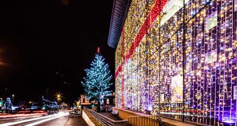 Christmas lights on tree and lights in window like a christmas box bow on Braid Centre