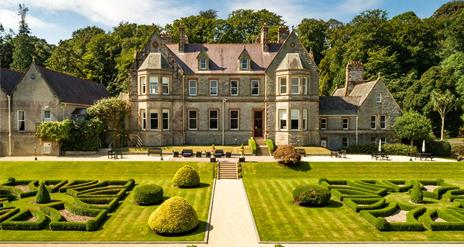 Magherarmorne Estate gardens with house to the rear