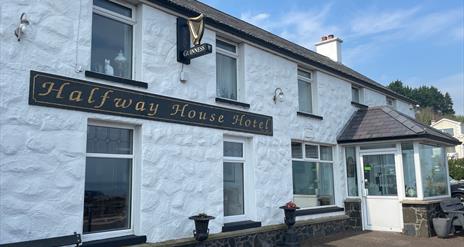 Whitewashed wall exterior of Halfway House Hotel in Ballygally