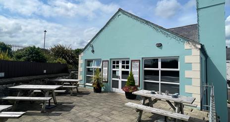 Exterior seating area of Harbour Lights Cafe in Carnlough