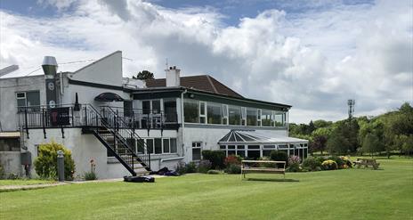 Cairndhu Golf Club ClubHouse - rear view with restaurant windows facing onto golf course.