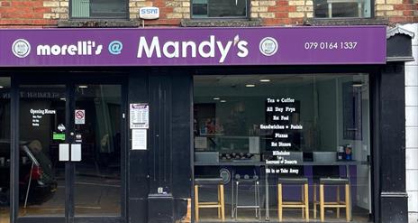 Shop front of Morelli's @ Mandy's with black frames and purple signage.