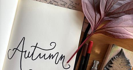 Picture  of autumn notebook and art materials