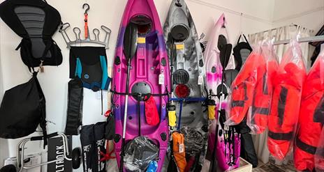 Kayaks and watersports equipment displayed in Salty Shack shop