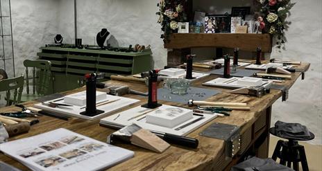 Table set up with equipment for jewellery making class at Vera McCullough's