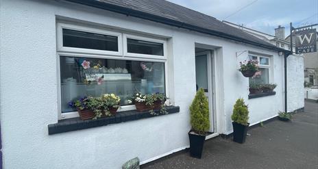 White cottage style exterior of Weavers Cafe in Ballycarry
