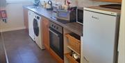 kitchen with washing machine and dishwasher