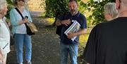 Alastair standing with tour guests in Old Churchyard