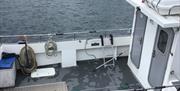 Small fishing boat Amberjack moored in Carnlough Harbour