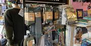 Display of outdoor socks, hats and scarves plus vintage books