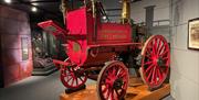 Red vintage pull along fire carriage branded Carrickfergus Fire Brigade