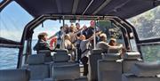 Group of visitors enjoying scenery on Charter Boats NI