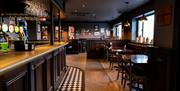 High and low level bar seating with rustic bar in Katy Jane's Bar