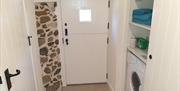 Exposed stone wall within Cloghin Cottage.