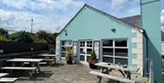 Exterior seating area of Harbour Lights Cafe in Carnlough