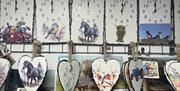 Wooden clocks and hearts wtih hand painted scenes with animals and birds