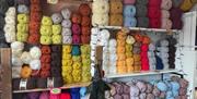 Large range of different coloured wool on display