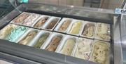 Ice cream counter with various flavours of Mauds Ice-Cream