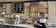 Serving counter at Mauds with hot drinks menus, coffee machines and ice cream containers