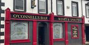 Red exterior of O'Connells Bar in Portglenone.